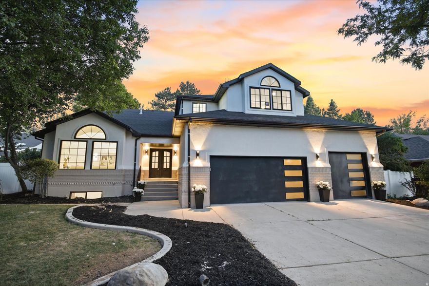 Nestled within the coveted Quail Meadow community, this nearly 4,800 sq. ft. luxury residence has been completely reimagined through an extensive high-end renovation where every detail was intentionally designed and expertly curated. Offering 5 bedrooms, 3.5 bathrooms, a 3-car garage with rare oversized height, and exceptional entertaining spaces throughout, this home delivers the scale, sophistication, and craftsmanship expected at the highest level.  A dramatic first impression unfolds the moment you enter. Soaring two-story ceilings span the grand entry, formal living room, formal dining room, and statement staircase, creating an immediate sense of openness and architectural presence rarely found in the area. Thoughtful designer finishes, elevated lighting, custom details, and intentional design elements carry throughout every inch of the home.  At the heart of the residence is a truly stunning chef's kitchen designed for both everyday luxury and entertaining. Quartzite countertops, custom cabinetry, a statement 48-inch professional gas range, and a striking stone-wrapped hood create a space that is as functional as it is beautiful. Seamlessly hidden behind custom cabinetry lies one of the home's standout features, a concealed butler's pantry offering additional prep, storage, and entertaining space.  The thoughtfully designed main floor offers formal and casual gathering spaces alike, including elegant formal living and dining rooms, a spacious breakfast area, a warm family room anchored by a fireplace, and an expansive laundry room.  Upstairs, the primary suite offers a true retreat experience. The spa-inspired bathroom features a freestanding soaking tub, oversized custom-tiled shower, and elevated designer finishes throughout. The oversized custom walk-in closet, complete with a center island and dedicated stackable washer and dryer hookup was designed with both luxury and convenience in mind. Two additional generously sized bedrooms and a full bathroom with custom tile complete the upper level.  The fully finished lower level expands the home's versatility with two additional bedrooms, a full bathroom, an expansive family room, and a full second kitchen, ideal for entertaining, extended guests, or multigenerational living.  Located on Millcreek's desirable east side with convenient access to world-class skiing, hiking, downtown Salt Lake City, dining, and recreation, this is a rare opportunity to own a fully transformed luxury residence where timeless design meets modern living.