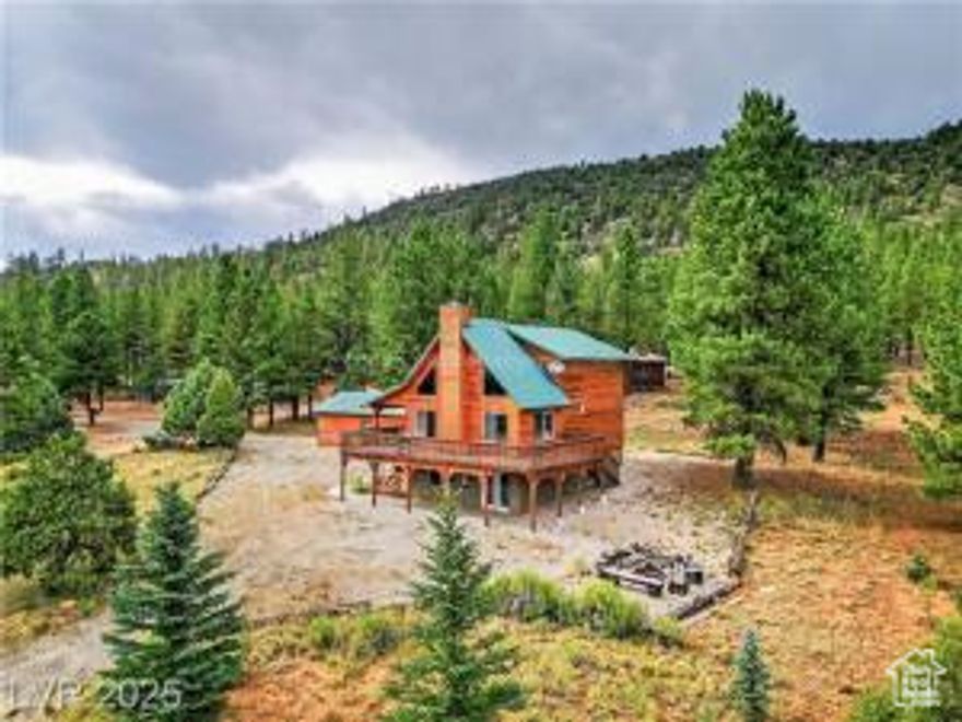 Your mountain base camp in Aspen Highlands, Mammoth Creek, UT, is calling. Start the day reeling in trout from the creek across the street, carve fresh lines at Brian Head, or cast into Panguitch Lake. As evening falls, breathe in crisp pine air from the 3/4 wraparound covered, lighted deck, then gather by the crackling wood-burning fireplace beneath vaulted ceilings. Three bedrooms and three baths-one per floor-offer space for everyone. The walk-out basement hosts a bedroom, bath, laundry, and a family room built for stories after the adventure. With paved access, year-round water, and a detached garage for ATVs and gear, this retreat delivers comfort, convenience, and endless outdoor thrills.