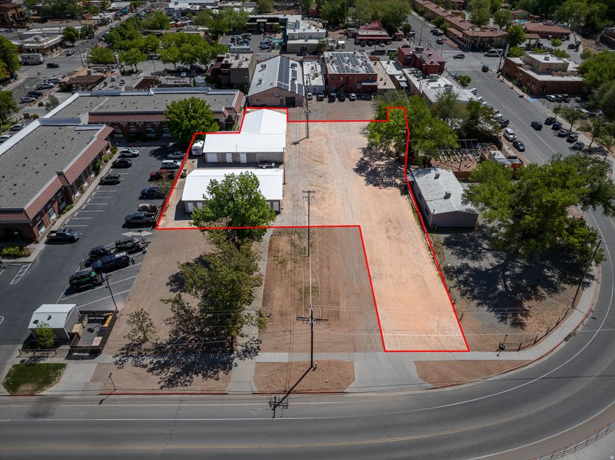 DOWNTOWN DEVELOPMENT WITH STORAGE UNITS-  These two parcels combined total 0.73 acre and are close to it all! Retail, restaurants, and multiple hotels just a stone's throw away. With Moab City's Commercial 3 zoning, these lots allow for a multitude of commercial and mixed uses. Use the storage units currently in place maintaining steady income while you plan your next commercial venture. Dreaming of building a cafe with apartments above? Planning to build an office building or a mix-use development with retail and restaurant space? Here is your site to do it all with high visibility in the heart of downtown Moab!