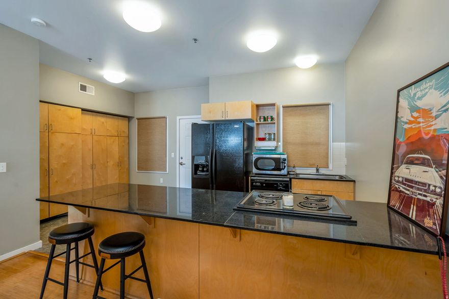 Discover urban living at its best in this stylish studio condo at the Library Square Condominiums, perfectly positioned right on 500 S. and directly across from the former Leonardo building and Salt Lake City Public Library. With downtown energy, Washington Square Park, and some of the city's best restaurants and shopping just steps away, this home puts you in the center of everything.  Inside, you'll find 9foot ceilings, hardwood flooring, and a smart, open layout enhanced by a divider wall that creates a defined bedroom area. The kitchen features granite countertops, a dining peninsula, and plenty of storage - complemented by the condo's generous closet and storage space throughout. A full bathroom and inunit washer and dryer add everyday convenience.  Enjoy fresh air and city views from your private balcony, or head up to the shared rooftop terrace for relaxing, entertaining, or soaking in the skyline.   - Prime downtown location on 500 S   - Directly across from the SLC Library   - Steps from Washington Square Park, dining, and shopping   - 9-foot ceilings & hardwood floors   - Granite countertops & dining peninsula   - Studio layout with bedroom divider wall   - Excellent closet and storage space   - Full bathroom   - Private balcony   - Shared rooftop area   - In-unit washer & dryer  No Parking included with unit, but Wasatch Manor next door has parking spots available for $75 per month.