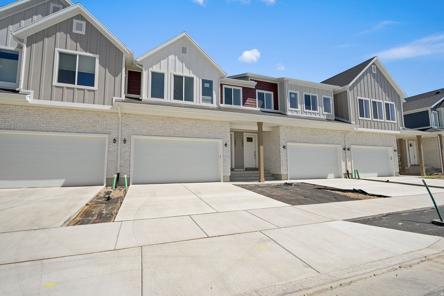 Brand new move in ready unit! Extremely large townhome with over 2700 SQ FT! 3 bedrooms, 2.5 bathrooms and an unfinished basement. Large family room with quality finishes including quartz countertops, soft close cabinets and stainless steel appliances. 9' tall main floor ceilings. Beautiful community with pickleball courts, playground and a dog park. Conveniently located close to shopping and the new West Davis Corridor. $15,000 incentive towards a rate buydown or closing costs using the preferred lender!