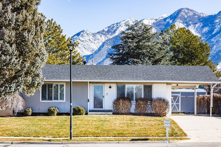 BACK ON MARKET due to the buyer's financing. Sellers have added a BRAND NEW ROOF with 50 YEAR LIFESPAN! Thisturnkey Sandy rambler is a GEM that blends charm with modern updates. The bright white kitchen features stainless steel appliances, a dining area, and additional storage. The upstairs has two bedrooms and an updated main-level bathroom. Downstairs, you'll find a family-friendly Basement Apartment with two bedrooms, a cozy living area, and a vintage bathroom full of character. An ideal setup for multigenerational living. New carpet throughout the basement. Outside, there is a spacious backyard shaded by mature trees. Exterior features includeRV parking, a Bee-Hyve smart sprinkler system, and hard-wired Ring cameras at the front door and in thecarport for added security. Gun safe in the storage room is included and makes for a great safe for guns, documents, and or photos. Plus, enjoy the speed and convenience of Google Fiber internet.Enjoy easy access to shopping and restaurants, plus a quick 25-minute drive to Alta and Snowbird Ski Resorts for unbeatable skiing.