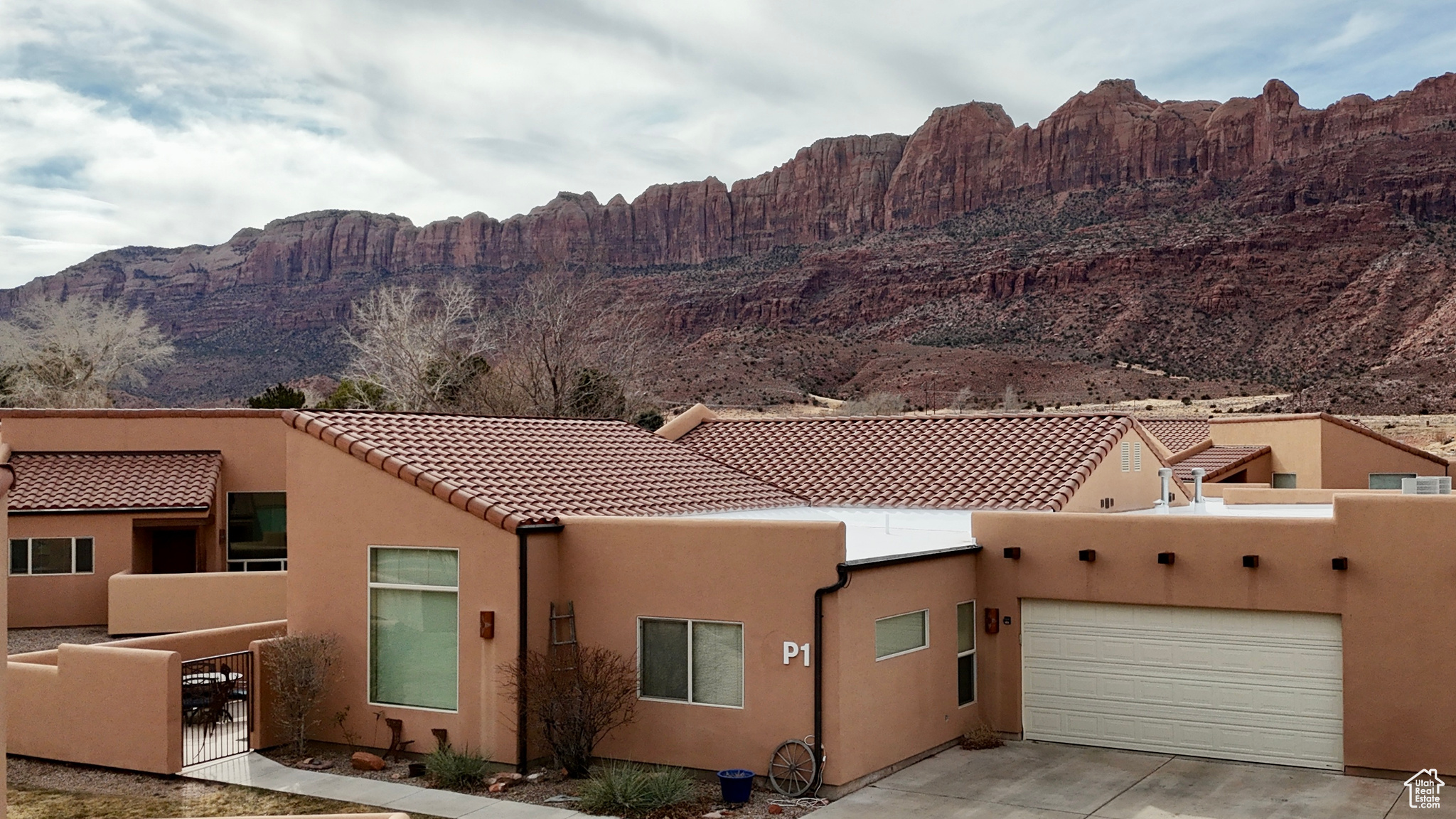 OFFERED TURN-KEY VACATION RENTAL  Nestled in the sought-after Rim Village community, this inviting 3-bedroom townhome offers a serene retreat with breathtaking views of Moab Rim and the La Sal Mountains. Ideal as both a personal getaway and a lucrative investment, the property allows short-term rentals for maximum flexibility.  Conveniently located just a short drive from downtown Moab, this home seamlessly combines tranquility with accessibility. Recent updates include an upgraded master shower, new carpet, and a brand-new kitchen countertop, enhancing both comfort and style.  As an added bonus, Rim Village is set to debut an updated pool and a new, larger community hot tub in 2025, providing even more relaxation and enjoyment for owners and guests.  Currently an active vacation rental, this townhome is offered fully furnished for a seamless transition. Please note: Current property taxes reflect primary residence status; if not a primary residence, estimated taxes are approximately $6,087.