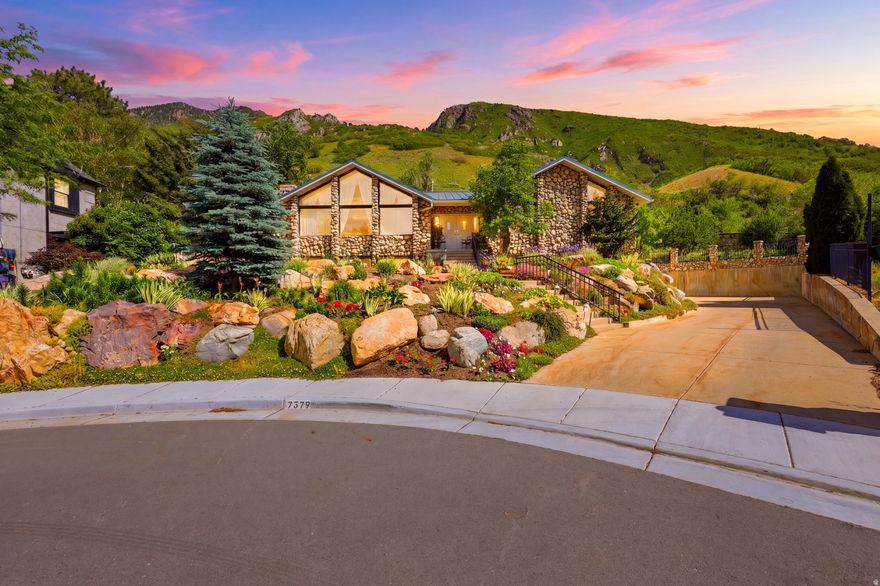 Nestled at the end of a quiet cul-de-sac and backing directly to National Forest land, this extraordinary mountain retreat offers a rare blend of privacy, functionality, and breathtaking natural beauty. From the moment you enter, your eyes are drawn through the home's stunning atrium to the surrounding mountains, creating an immediate connection to the landscape beyond.  Thoughtfully positioned on a beautifully landscaped lot, this property stands apart with one of the few flat driveways in the neighborhood-a significant investment by the owners that provides exceptional convenience, abundant parking, and year-round accessibility. With room for up to 15 vehicles, RV parking, and an impressive 5-car garage/shop configuration, there's space for everything from daily drivers to recreational toys and workshop projects.  Inside, you'll find expansive living spaces featuring vaulted ceilings, a beautiful sunroom, abundant built-in storage, granite countertops, multiple fireplaces, and a spacious primary suite complete with a walk-in closet, separate tub and shower, and spa-like comfort. Recent updates include new flooring and new toilets in the upstairs bathrooms.  Step outside to your own private retreat. The fully fenced and gated heated pool area is designed for both relaxation and peace of mind, while multiple decks and outdoor living spaces provide the perfect setting for entertaining or simply enjoying the mountain views. Wake each morning to mountain views, spend your afternoons beside the pool, and end your evenings with the peace and privacy that only a home bordering a National Forest can provide.  Additional features include a durable metal roof with snow-shedding design, leaf guards, three furnaces, two water heaters, newer water softener, hot and cold water in the garage, EV charging capability, workshop space, and abundant storage throughout.