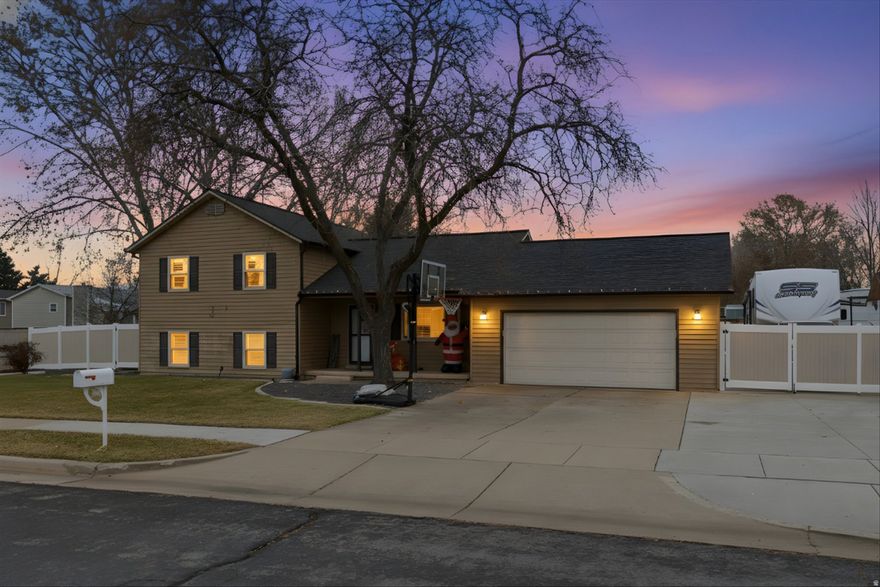 This well-maintained multi-level home offers thoughtful updates and functional space throughout. Major improvements include new windows in 2016, with plantation shutters on the front windows, a new roof in 2020, and an added covered back patio-perfect for outdoor entertaining. The property also features an expanded RV pad, adding valuable flexibility for parking and storage. Inside, new carpet installed in 2021 freshens the living spaces, and the bathrooms have been tastefully updated. Furnace age and roof installation year to be verified; seller has maintenance records available. Situated on a spacious, fully fenced corner lot with mature landscaping, this home combines solid upgrades, smart functionality, and pride of ownership.