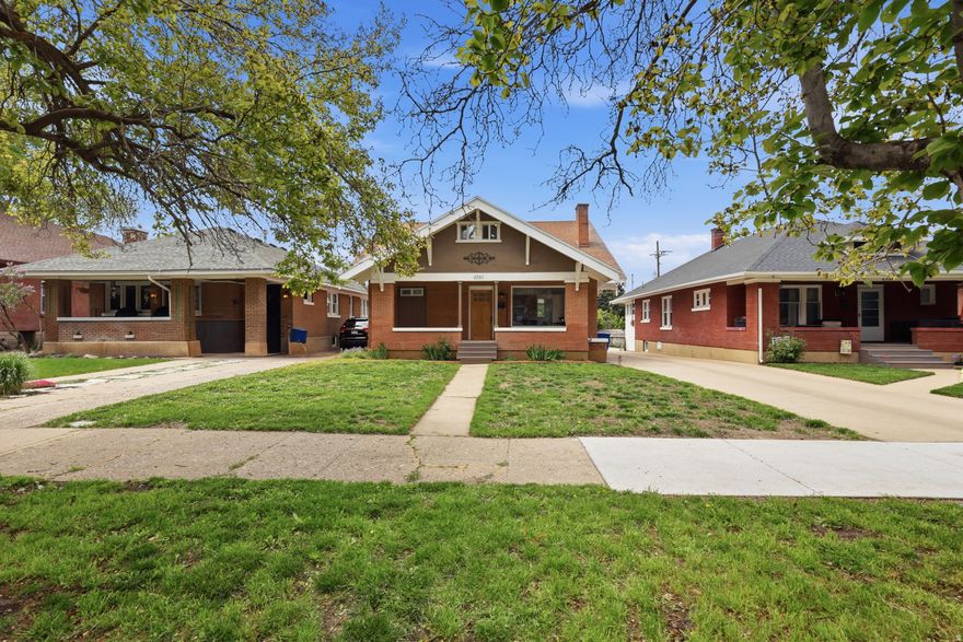 Located on one of Ogden's most desirable streets, this move-in-ready home offers a rare combination of space, style, and versatility. Thoughtfully designed for comfortable living, the home features multiple levels that provide flexibility for a variety of needs, whether for a growing household, guests, or work-from-home options. The main level welcomes you with a charming covered front porch and opens into a beautifully finished interior. Here you'll find a warm and inviting living area, along with a well-appointed kitchen showcasing upgraded finishes, soft-close cabinetry, and a dedicated butler's pantry with a separate prep space and conveniently located laundry nearby. Two bedrooms and two full bathrooms complete the main floor, all finished with a refined touch. Upstairs, additional living space includes two bedrooms, a full bathroom, and a flexible bonus room that can easily adapt as a playroom, office, or lounge. The lower level adds even more functionality, offering generous storage, a very large bedroom, and an additional living area that can serve as a guest suite, recreation room, or private workspace. Outside, the property continues to impress with a fully fenced backyard, a detached storage or workshop building, and beautiful brick detailing that enhances the home's character. Recent updates include a new roof and new appliances, providing peace of mind for years to come. Parking is plentiful with two covered spaces, an oversized shared driveway, and ample rear parking. Altogether, this home delivers comfort, flexibility, and charm in a prime Ogden location.