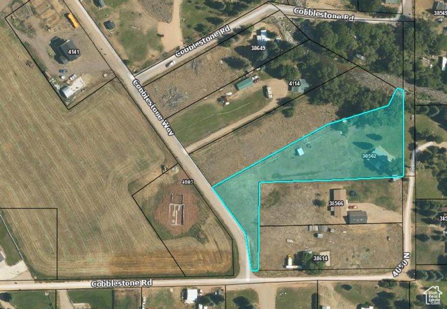 Large grassy acreage. lot back is filled could be solid.  We have the right of way from the road.  beautiful view of tabby mountain. riverfront property. to Duchesne River. fir pit by river horseshoe hit, irrigation water. storage shed, and well house together an old garage which is used for storage or whatever you like septic tank propane tank beautiful property in Tabiona