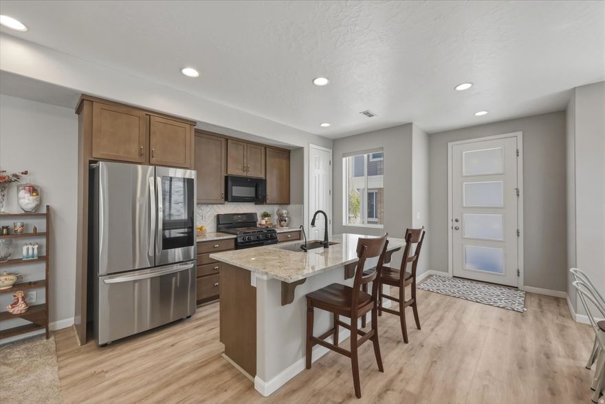 This stunning twinhome truly shows like a 10 and sits perfectly on the North end of Payson right along the Salem/Payson border- giving you the best of peaceful, country style living with everyday convenience just minutes away. Surrounded by breathtaking mountain views, this 3-bedroom, 2.5-bath home offers that rare balance of open skies, fresh air, and modern comfort. Inside, you'll love the bright, open-concept layout featuring 9-foot ceilings on both levels, abundant natural light, low-profile carpet, and durable LVP flooring throughout. The upgraded kitchen is designed for both function and style, showcasing 42" cabinetry, granite countertops, and easy access to a private patio just off the dining area-perfect for relaxing or entertaining. The spacious family room, recessed lighting, and thoughtful upgrades like window shades and a water softener make this home truly move-in ready. Upstairs, the primary suite offers a peaceful retreat with a large walk-in closet and well-appointed bathroom, while additional bedrooms provide flexible space for family, guests, or a home office. Enjoy a quiet neighborhood setting with nearby parks and pickleball courts, all while being just minutes from I-15, shopping, dining, and located within the highly sought-after Salem.
