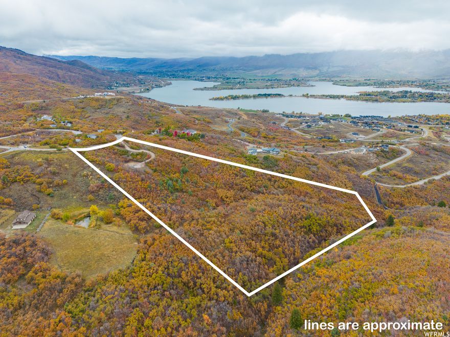This remarkable property has expansive views of Pineview Reservoir, Huntsville valley, and the surrounding mountains. The property is approximately 15 minutes away from the Snowbasin Ski Resort and within a short drive to Powder Mountain and Nordic Valley resorts. Build your dream home of any size on this beautiful 11.3 acres. The property has scrub oak, maple trees and brush, and there is a small stream on the east boundary. This adventure property is your gateway to golfing, hiking, biking, sailing, fishing, and other water sports in summer and downhill and cross-country skiing, snowmobiling, skating, and tubing in winter--all with the ease of returning home to relax in the same location. Geological and soil studies have been done. Percolation tests are completed and a septic system has been approved. The well was drilled in July 2023, 305 feet deep, and is pumped and ready for connection. This lot is approved as a one lot subdivision and there is no HOA.