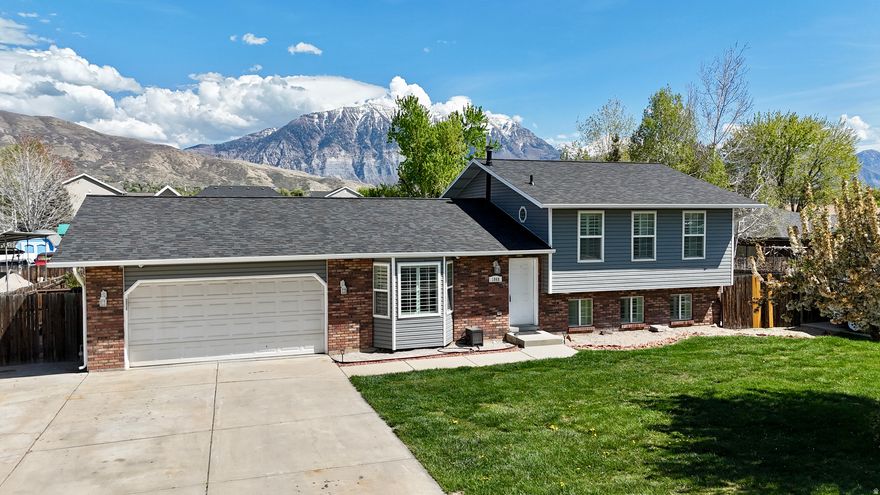 Move-in ready home in desirable Northeast Orem, located on a quiet cul-de-sac! This well-maintained property features a brand new roof and siding, along with a functional layout offering 5 bedrooms, 2 bathrooms, and a dedicated office/work space. The main level includes a welcoming living room, kitchen, and dining area, while the lower-level family room showcases custom cabinetry and built-in display lighting-perfect for entertaining or relaxing. Enjoy a fully fenced backyard with stunning Mount Timpanogos views, RV parking, and a deep 2-car garage. This is a must-see!