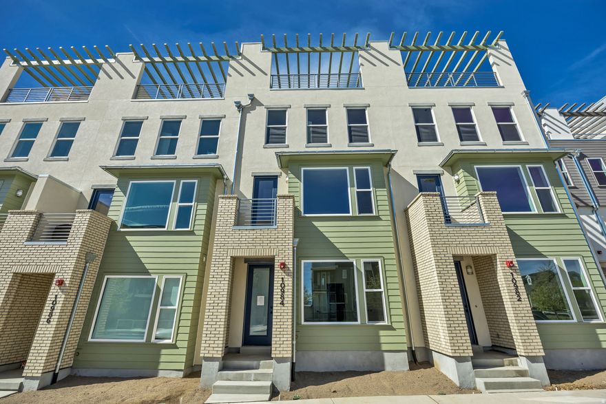 Living in Downtown Daybreak right near the Bees Stadium, Shops, Restaurants, & Year -Round Local Events! This Major League Model Brings Serious Upgrades: a Sleek Caf-Style Kitchen, Two Cozy Fireplaces (One in the Living Room, One in the Sky-room), & a Built-in Wet Bar for Elevated Entertaining. The Open Concept Floor Plan is Flooded with Natural Light, Creating an Easy Flow from Room to Room. Head up to the Sky-room and Rooftop Deck for Unbeatable Views, ready for your future Private Hot Tub! Whether You're Hosting or just Hanging out, this Home Brings it all: Style, Space, and the Best Location in the City! Move in Ready!!