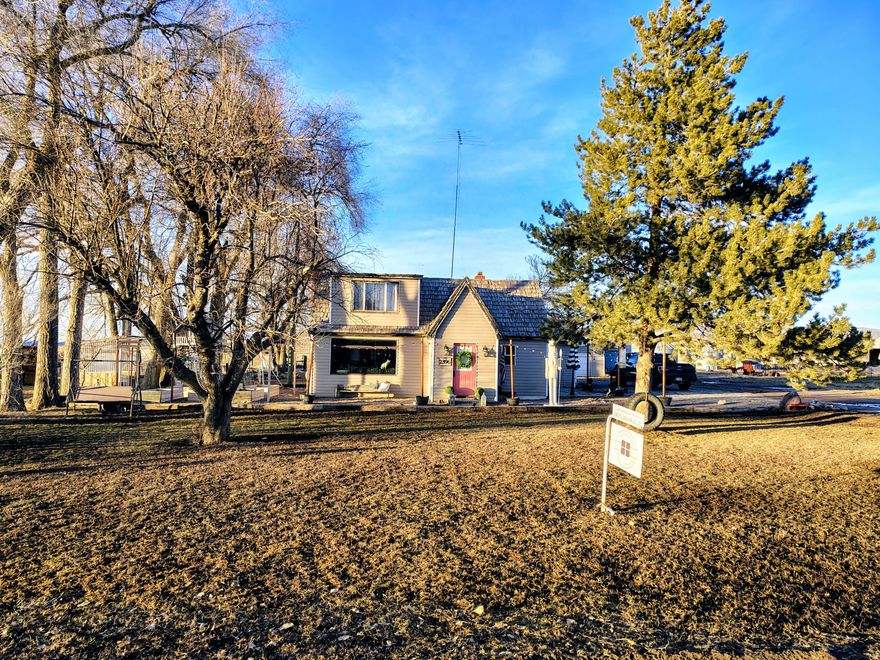 Adorable cottage home in a beautiful country setting!  This home is charming inside and out! Large family room with a wood burning stove that is sure to keep you cozy and warm during the cold months.  There is plenty of room for your animals and storage for your toys, plus a greenhouse, chicken coup and dog kennel.  Also, a grain bin made into a critter cave!  Make your appointment to see this cute home today!