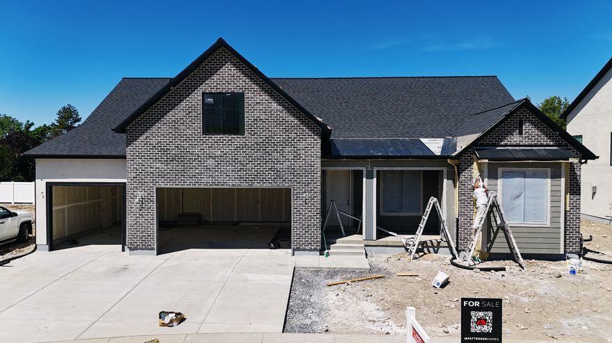 This Transitional styled Rambler with Bonus was designed for this lot in Orem. This home is designed with the family in mind. The bonus area features a large bedroom with walk-in closet a full bath and loft, a perfect hangout for the kids. The Home is set up perfect for a future ADU with Basement entrance and RV parking. The family room is 12' with stacked windows for all the natural light. Cafe appliances, an impressive cabinet package and so much more. Call for your personal showing!