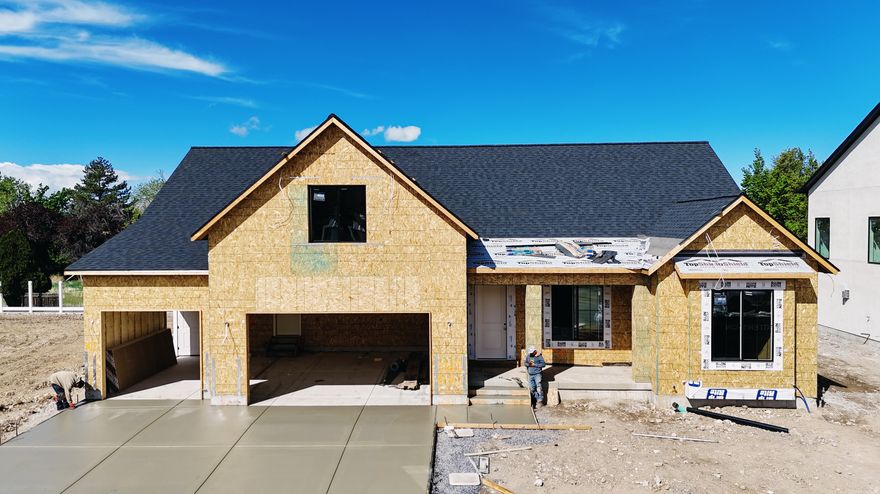 This Transitional styled Rambler with Bonus was designed for this lot in Orem. This home is designed with the family in mind. The bonus area features a large bedroom with walk-in closet a full bath and loft, a perfect hangout for the kids. The Home is set up perfect for a future ADU with Basement entrance and RV parking. The family room is 12' with stacked windows for all the natural light. Cafe appliances, an impressive cabinet package and so much more. Call for your personal showing!