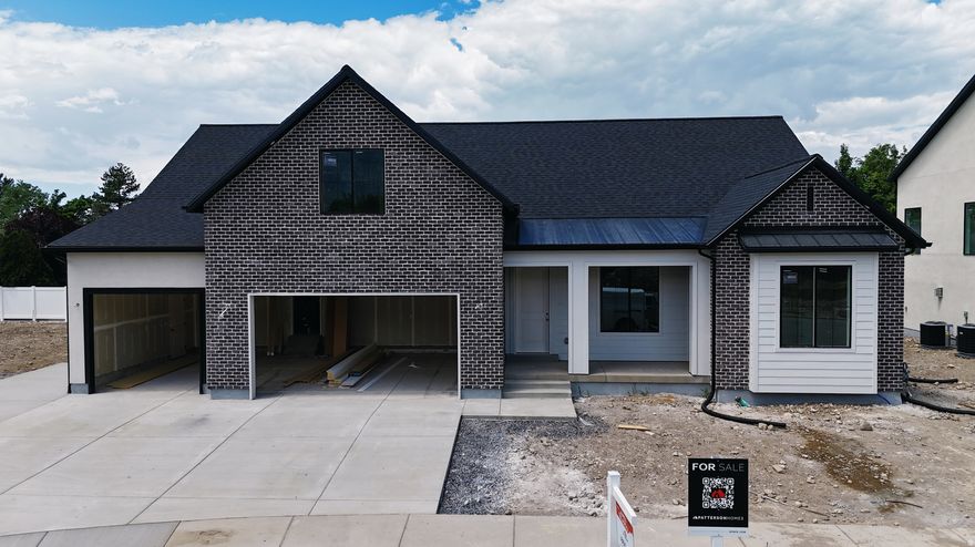 This Transitional styled Rambler with Bonus was designed for this lot in Orem. This home is designed with the family in mind. The bonus area features a large bedroom with walk-in closet a full bath and loft, a perfect hangout for the kids. The Home is set up perfect for a future ADU with Basement entrance and RV parking. The family room is 12' with stacked windows for all the natural light. Cafe appliances, an impressive cabinet package and so much more. Call for your personal showing!
