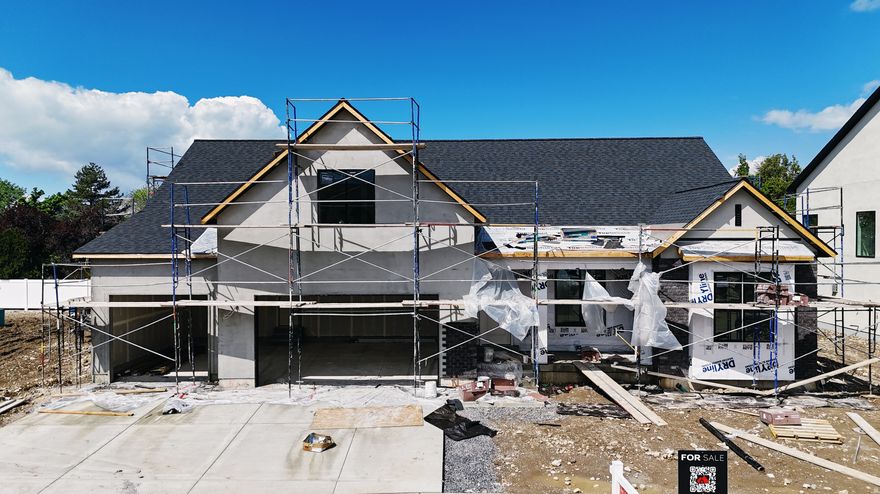 This Transitional styled Rambler with Bonus was designed for this lot in Orem. This home is designed with the family in mind. The bonus area features a large bedroom with walk-in closet a full bath and loft, a perfect hangout for the kids. The Home is set up perfect for a future ADU with Basement entrance and RV parking. The family room is 12' with stacked windows for all the natural light. Cafe appliances, an impressive cabinet package and so much more. Call for your personal showing!