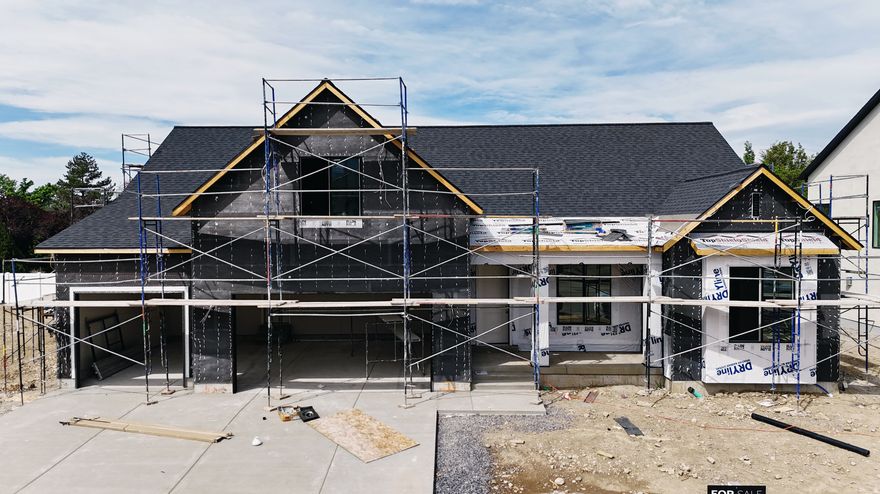 This Transitional styled Rambler with Bonus was designed for this lot in Orem. This home is designed with the family in mind. The bonus area features a large bedroom with walk-in closet a full bath and loft, a perfect hangout for the kids. The Home is set up perfect for a future ADU with Basement entrance and RV parking. The family room is 12' with stacked windows for all the natural light. Cafe appliances, an impressive cabinet package and so much more. Call for your personal showing!