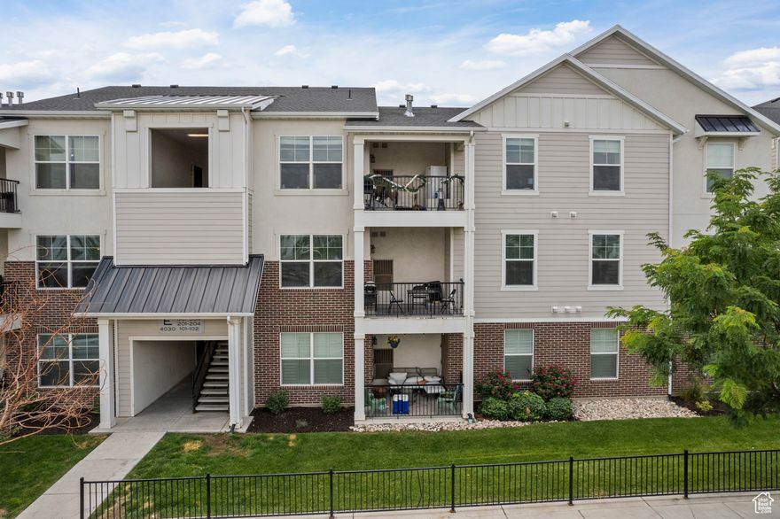 Beautifully maintained middle-level condo in a prime Lehi location!   Features 3 bedrooms, 2 bathrooms, an open-concept layout, modern finishes, and a garage.   Enjoy natural light, quiet building placement, and easy access to parks, schools, shopping, and Silicon Slopes. Experience low-maintenance living with comfort and convenience. Schedule your showing today!
