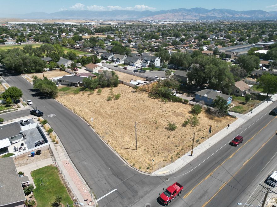 Perfect for the savvy Land / Multifamily investor, this property is strategically located in the desirable Magna area and is zoned R-2-6.5, offering great potential for multifamily development. With its prime zoning designation, this parcel presents an exceptional opportunity for building residential units that cater to the growing demand for high-quality housing in the area. The property's ideal location in Magna ensures access to a range of amenities and conveniences, making it a promising investment for those looking to capitalize on the thriving real estate market in this sought-after neighborhood.  Exceptional 0.77-acre corner lot at 7382 W 3500 S in Magna-prime for development with past plans approved for three duplexes (six total units). Positioned on an intersection, this flat, build-ready parcel offers outstanding visibility, utility access, and strong resale potential for the end product. Ideal for developers seeking a multi-family opportunity in a growing area, just minutes from major amenities and commuter routes.