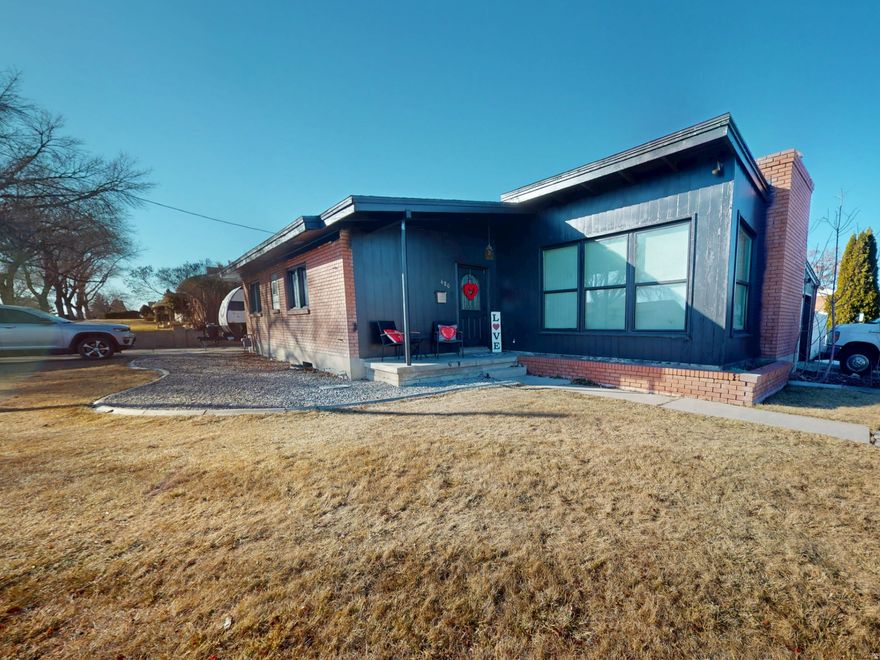 Welcome home to this beautifully updated 4 bedroom, 2 bathroom property located in a quiet neighborhood in Price, Utah. This spacious home blends modern upgrades with comfortable living, offering plenty of room for family, entertaining, and everyday life.  Step inside to a bright and inviting layout featuring a large living room with warm flooring, a cozy fireplace, and abundant natural light - the perfect place to relax or gather with guests. The updated kitchen shines with freshly painted cabinetry, sleek countertops, stainless steel appliances, a stylish subway tile backsplash, and ample cabinet space, making meal prep both functional and enjoyable.  The home offers four generously sized bedrooms and two full bathrooms, providing flexibility for families, guests, or a home office setup. Modern finishes and thoughtful updates throughout give the space a clean, move-in-ready feel. new roof put on in 2024  Outside, you'll love the single-level layout, easy-maintenance yard, and convenient parking, all set against the beautiful backdrop of Carbon County. With plenty of space inside and out, this home delivers comfort, value, and practicality.  Located close to schools, parks, and local amenities, this is an excellent opportunity to own an updated home in an affordable Price neighborhood.  Don't miss your chance to make this one yours!