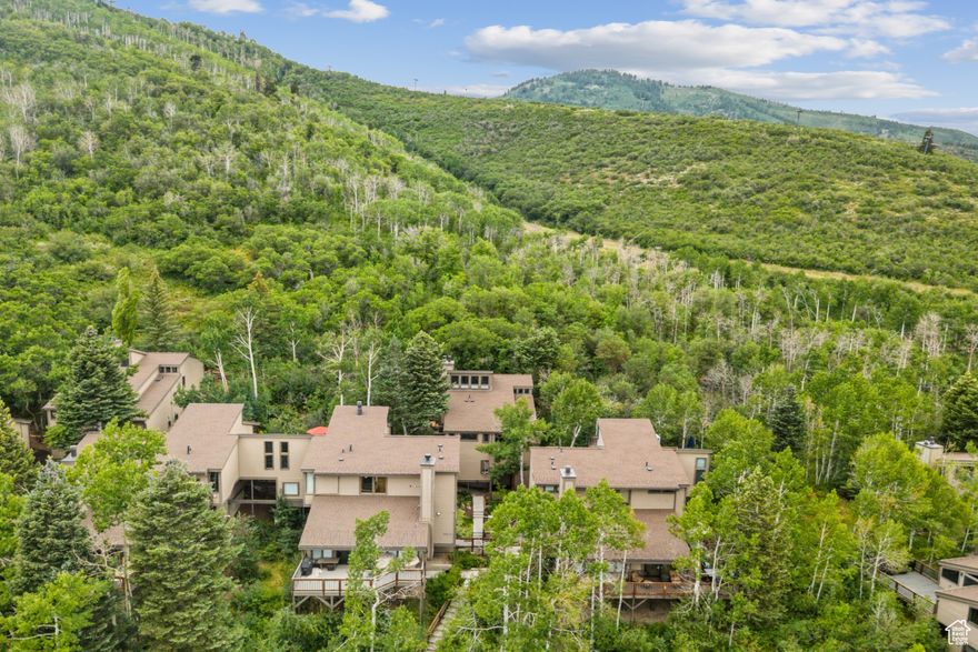 Tucked into the highly desirable Crescent Ridge community, this mountain condo delivers the perfect blend of comfort, space, and ski access. Offering two bedrooms and a large bunk loft and three full bathrooms, the property comfortably sleeps up to 9 guests-ideal for family getaways or hosting friends. Skiers will love the convenience of strolling a flat path before gliding down to the Eagle, Three Kings, and First Time lifts. The Silver Star Chairlift and popular Silver Star Caf are also just a short walk away, putting world-class skiing and dining at your fingertips. The interior features soaring ceilings with a newly refreshed sun room looking out in to the Aspen forest,  the natural light fills the open-concept great room. A well-equipped kitchen allows for home-cooked meals, or enjoy the vibrant energy of nearby Old Town for dining and nightlife. After a day on the slopes, relax on your private deck and take in the peaceful, wooded surroundings year-round. The condo has a one car dedicated garage in a shared space along with several private storage lockers. An additional spot is available for guest parking in front of the garage. With its seamless balance of natural charm, cozy living, and unparalleled access, this property is the ultimate slope-side retreat in Park City.