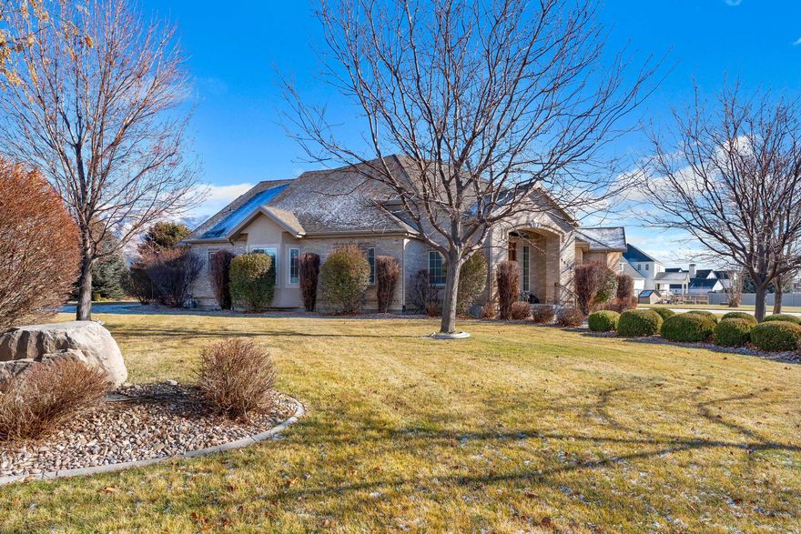 Expansive 6300+ square ft  rambler situated  on a rare .93-acre HIghland lot offering space and   future potential, including room for a pool, sport court, garden and/or large detached garage/workshop. A grand foyer with soaring ceilings welcomes you into a bright, open floor plan with 9-foot ceilings on the main level and higher ceilings in the family room and entry. This home features 7 bedrooms plus an office. The kitchen includes hardwood floors, granite countertops, and a walk-in pantry. The spacious primary suite offers a large bathroom with dual sinks, separate tub and shower, and his-and-hers walk-in closets. Secondary bedrooms are generously sized  with ensuite   or Jack-and-Jill bathrooms. The walkout basement includes a possible ADU with separate entrance, full kitchen with huge island  and dining area, separate laundry room, and abundant storage-ideal for multi-generational living, a rental  or entertaining. Enjoy the east-facing back patio with mountain views and natural shade. Additional highlights include tons of storage, an oversized 3-car garage, and convenient access to trails, schools, shopping, freeway access, and just 10 minutes to the Traverse Outlets.