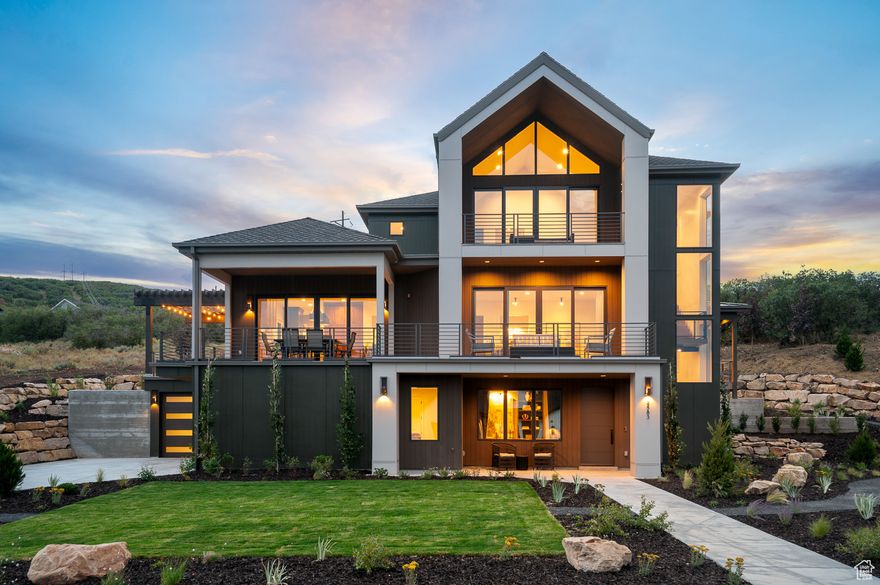 This exquisite custom home showcases luxury finishes and timeless craftsmanship throughout. The kitchen is a true centerpiece with walnut maple cabinetry, quartzite countertops, a full-height quartzite backsplash, and professional-grade Wolf stainless steel gas appliances. Rich hardwood floors flow seamlessly alongside tile and carpet in key living spaces. Thoughtful details include black matte hardware, three-tone paint, and beautifully tiled bathroom surrounds. Cozy up by one of the gas log fireplaces located in the living room, owner's bedroom, and sitting room. Modern conveniences such as an outdoor firepit, heat tape, electric car charger, indoor water feature and a water softener elevate everyday living. A perfect balance of elegance and comfort. You do not want to miss out on this home!