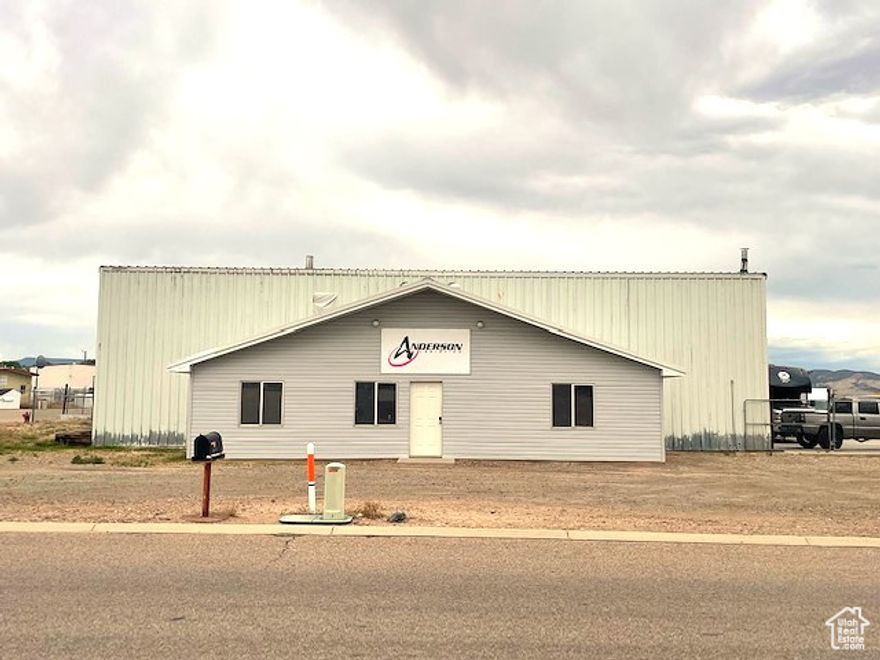 Location, location! This building is in Industrial zoning near the Vernal airport. It has approximately 1000 Sq.ft. of Office space and 3726 Sq.ft. of Warehouse space. It currently has a tenant in the building. Contact agent for more information. Great opportunity as an investment! Information provided as a courtesy, buyer to verify all information.