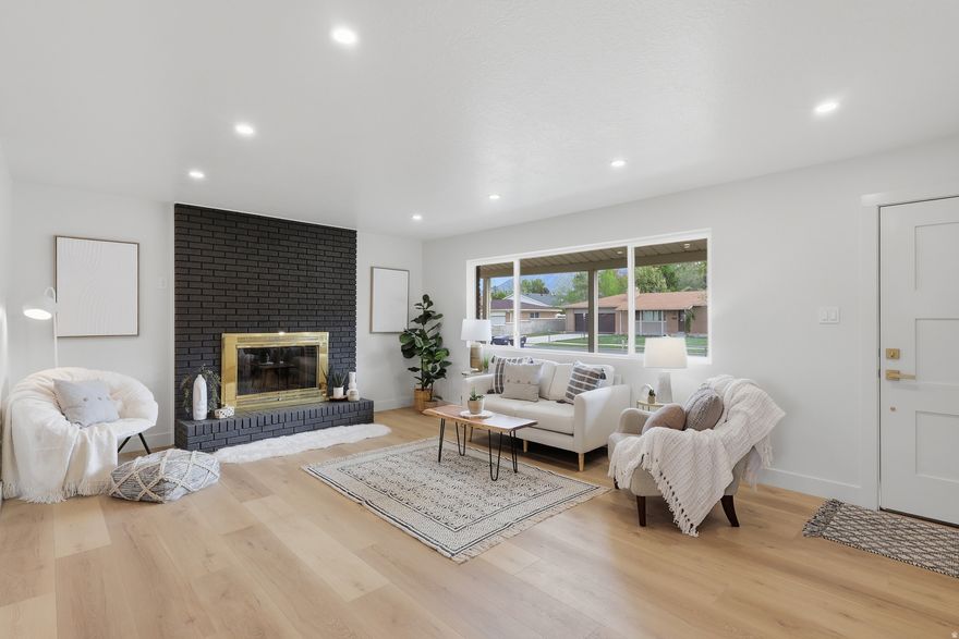 Wasatch mountain views year round!! Huge primary suite walk-in closet, with additional laundry hookups make for easy single-level living! Open floor plan with kitchen island. This 5 bedroom, 3 bathroom home in Sandy, Utah has been thoughtfully remodeled (permitted by Sandy City). New, New, New throughout. Including new HVAC and updated windows (2025-26). Main laundry room with rubber gym flooring just off the family room. Covered RV parking attached to shop and even more storage in additional sheds. Gather around the fire either inside or out! Fully fenced yard. You'll see people out walking and visiting in what feels like a true neighborhood.