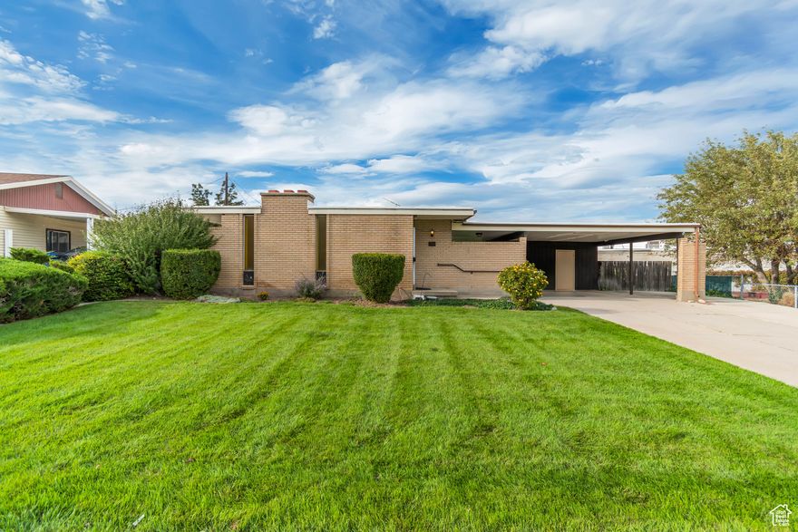 Welcome home to this charming Taylorsville rambler. Rarely available this charming rambler in the heart of Taylorsville is ready for its 2nd only owner, to  move in and create new memories Nice wood accents throughout the home, new carpet upstairs and neutral paint colors. A stand out feature is the separate walk out basement, which could be turned into an ADU or an income producing property to offset mortgage payment! The upstairs has hardwood floors under the carpet as well. Enjoy the outdoors on a generously sized, extra large, .28 acre yard with beautiful green grass to play on! Extra large carport for at least 2 vehicles! RV parking on the side of carport! Come see it today!