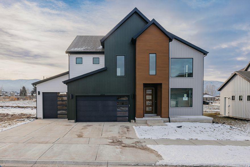 ***Huge Incentives***Welcome to Fieldstone's stunning Pinedale floor plan in The Crossings in Heber City-one of the most sought-after communities in the valley, surrounded by beautiful mountain views in every direction. This home features over 3,900 square feet, a fully finished basement, and an incredible $166,900 in upgrades.  Inside, you'll love the dramatic open-to-below vaulted ceilings, abundant natural light, and huge windows that make the home feel bright and expansive. An open loft provides the perfect bonus space, complete with a walkout balcony, while spacious rooms and large closets offer comfort and storage throughout.  The upgraded gourmet kitchen is a showstopper with a massive oversized island, double ovens, a beautiful cooktop with overhead range hood, and upgraded LVP flooring-perfect for entertaining and everyday living. Conveniently located near Main Street and shopping, this home is ideal for outdoor enthusiasts with easy access to hiking and recreation, just 15 minutes from Deer Creek Reservoir and Jordanelle State Park, 25 minutes to Park City, and approximately 40 minutes to Salt Lake City.This is Heber living at its finest-spacious, upgraded, and surrounded by the best of Utah.