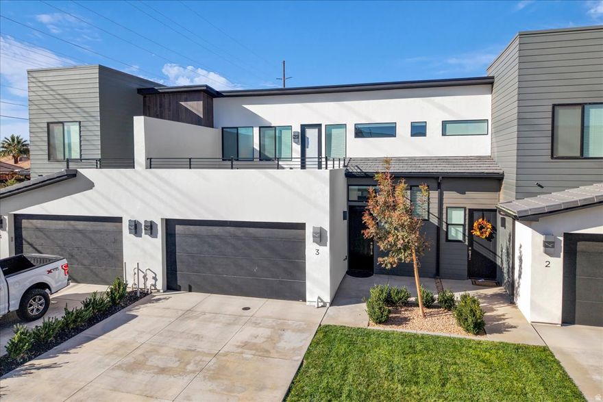 Relish and live it up a little in your own, spotless clean 2 story townhome immediately adjacent to the Sky Mountain golf course. Attractive views of red rocks and green grass from the upstairs deck of Over 2000sf, 4 generous size bedrooms, 2.5 baths. The primary suite is on the main level with it's own private bathroom. Certainly, poised for anyone's lifestyle. Main & upstairs family rooms offer separate areas for adults and kids to enjoy their favorite games, favorite shows and favorite friends. Squeaky clean as if Mr. Clean just left. No dings, no scratches and no vanilla. You'll most definitely see the difference between the homes being built and the first few the builder put in as extras. Residents enjoy resort-style amenities