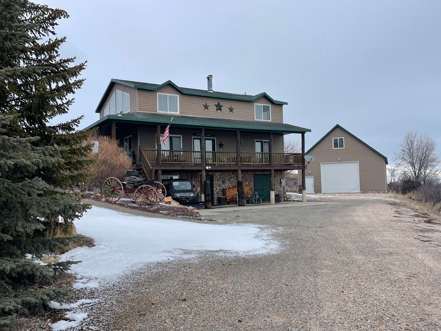 Turnkey Bear Lake cabin just over the Idaho border in coveted Bear Lake West - just unpack your groceries and enjoy! Soak in incredible views in every direction from the spacious great room or unwind on the covered deck. Plenty of room for entertaining large groups, with easy parking via a circular driveway. The detached oversized 32'x40' heated garage features a drive-through door and bunkroom above - a dream setup for storing all your toys and gear. Furniture and appliances included. Bear Lake West amenities include golf discounts, swimming pool, tennis and pickleball courts, and private beach access. Dine locally at the renowned Cooper's Restaurant and enjoy everything the Idaho side of Bear Lake has to offer - widely considered the best side of the lake with unmatched panoramic views and a true four-season lifestyle. This is the turnkey mountain retreat you've been dreaming of!