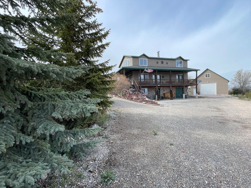 Turnkey Bear Lake cabin just over the Idaho border in coveted Bear Lake West - just unpack your groceries and enjoy! Soak in incredible views in every direction from the spacious great room or unwind on the covered deck. Plenty of room for entertaining large groups, with easy parking via a circular driveway. The detached oversized 32'x40' heated garage features a drive-through door and bunkroom above - a dream setup for storing all your toys and gear. Furniture and appliances included. Bear Lake West amenities include golf discounts, swimming pool, tennis and pickleball courts, and private beach access. Dine locally at the renowned Cooper's Restaurant and enjoy everything the Idaho side of Bear Lake has to offer - widely considered the best side of the lake with unmatched panoramic views and a true four-season lifestyle. This is the turnkey mountain retreat you've been dreaming of!