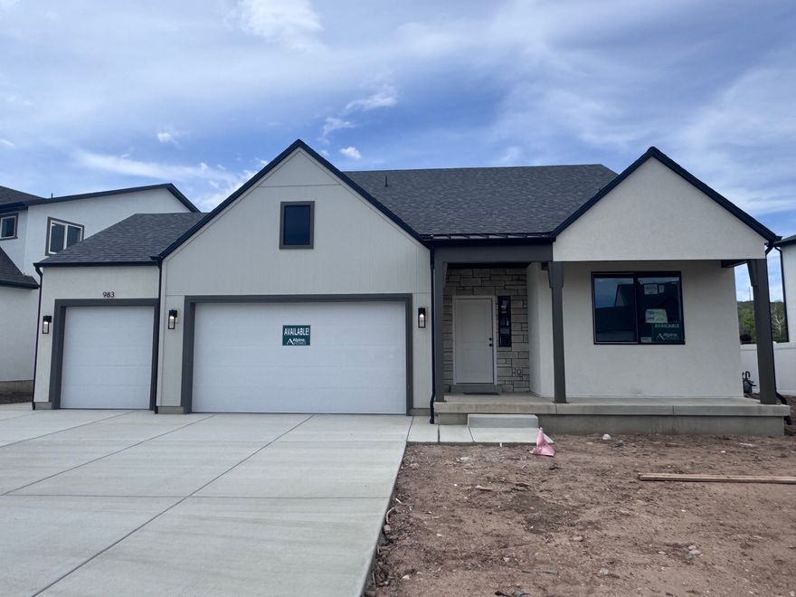 DREAM HOME, DREAM LOCATION. Ask about our rate-buy-down incentives! Perfectly situated within 5 minutes of Schneiter's Riverside Golf Course, the Riverdale Family shopping center, and the I-15/I-84 corridor. This stunning Summit plan features a 3-car garage with an RV pad. The open-concept main floor is designed for modern living, boasting a home office with double glass doors and a chef's kitchen featuring quartz countertops, stainless steel appliances, and soft-close cabinetry. A functional mudroom and walk-in pantry keep the home organized and clutter-free. With 5 spacious bedrooms and 4 bathrooms, there is room to grow. The primary suite offers a spa-like retreat with a deep soaker tub and separate walk-in shower. The fully finished basement features a private walk-out 2-bedroom ADU apartment-perfect for guests or rental income. This Parade of Homes-caliber property is built for entertaining! Call today to schedule your private tour. MODEL HOME: 1037 W Motor Vu Drive, Riverdale, UT 84405