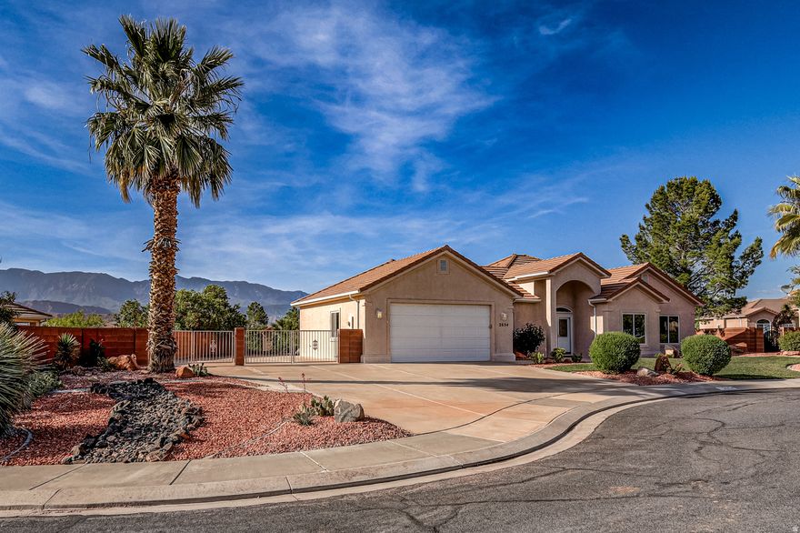 Updated, clean, and truly move-in ready, this low-maintenance home offers an inviting open floor plan with 3 bedrooms and 2 bathrooms--all framed by breathtaking views of Pine Valley Mountain that feel close enough to touch. Recent upgrades include new carpet, fresh interior paint (including a spotless, fully painted garage), new LVP flooring, modern light fixtures, updated appliances, new door and bathroom hardware, modern baseboards, and comfort height toilets giving the home a fresh, like-new feel throughout. A standout feature is the 180 sq ft heated and cooled workshop, perfect for hobbies, storage, or a private workspace. Bring all your toys--this property boasts HUGE gated RV parking with full hookups, including 30-amp electric service, making it ideal for travel enthusiasts. Tucked away on a quiet cul-de-sac with no HOA, this home offers peace, privacy, and convenience--an ideal retreat to relax, unwind, and take in the views!