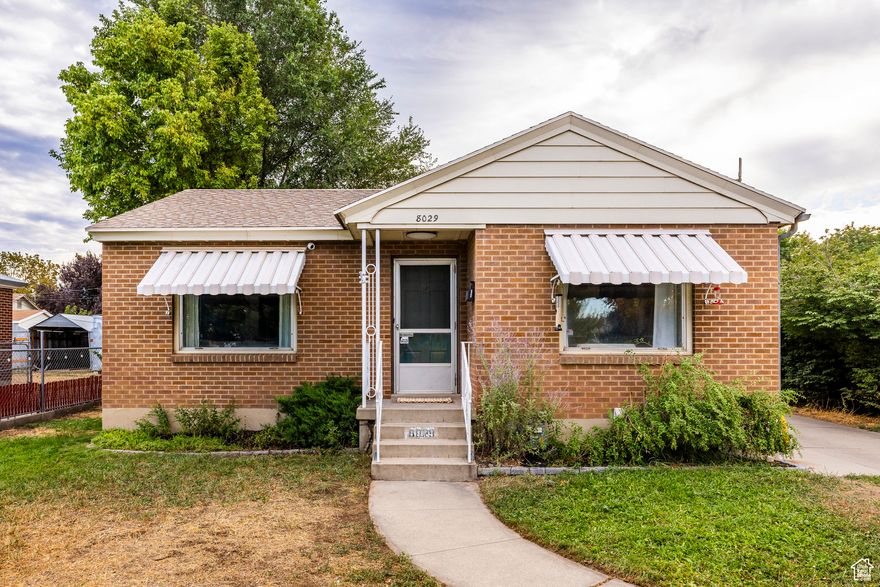 Charming 1950s bungalow just steps from the revitalized Main Street in Midvale! This well-maintained mid-century gem features beautiful brickwork, original oak floors, and tasteful updates that highlight its classic character. Natural light fills the home-even the basement-thanks to large picture windows and mature landscaping that add warmth and privacy. The spacious lot offers stunning views of Mt. Olympus and room to entertain under the stars. Rare for the area, the oversized 2-car detached garage is ideal for outdoor toys, hobbies, or extra storage. Walk to nearby Midvale Elementary and Middle Schools in minutes. Commuters will love the quick access to I-15 and State Street, while outdoor lovers can hit the slopes in under 20 minutes. A perfect starter home for couples, families, or roommates-this one won't last!