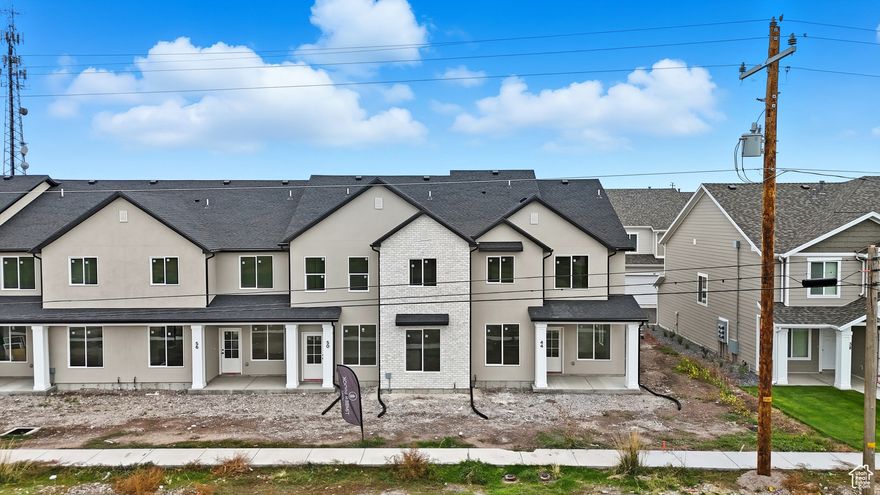 Discover the difference in this beautiful new construction end-unit townhome by Timber Brook Homes, one of Tremonton's most trusted builders. Designed with care and built to last, this home features a bright, open layout that feels spacious and inviting from the moment you walk in. The kitchen's custom cabinetry and thoughtful finishes reflect Timber Brook's commitment to quality. Upstairs, the spacious primary suite has a large, double-sink vanity and large walk-in closet.  Nestled in a quiet yet convenient location, you'll enjoy the perfect blend of comfort, style, and easy access to everything Tremonton has to offer.  The Seller is offering a $4,000 concession when using their preferred lender, Kaden Neimann with Bolt Mortgage. Come take a look today!