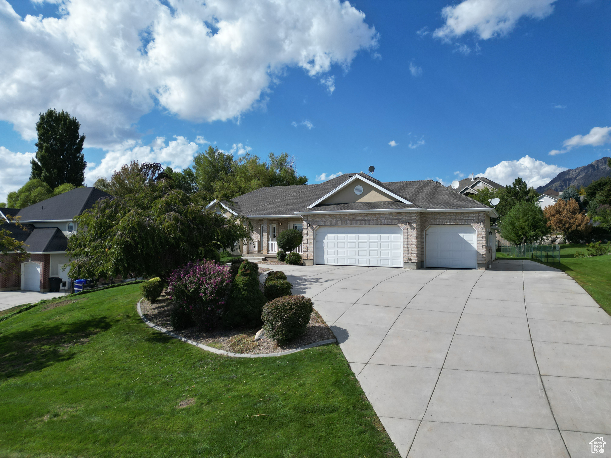 Location! Location! Location! This spacious, fully remodeled rambler sits on nearly half an acre (.46 of an acre) and offers breathtaking mountain views in every direction. From the moment you step inside, you'll appreciate the modern updates and thoughtful finishes throughout. The home features fresh paint, new flooring, updated lighting, and newer appliances. The kitchen has been beautifully renovated with quartz countertops and a stylish tile backsplash, while both bathrooms have been tastefully updated to match the home's feel. With generously sized bedrooms and an open, welcoming layout, there's plenty of space for comfortable living and family gatherings. Plus, the oversized garage includes a dedicated workshop area, perfect for projects, hobbies, or additional storage. Move-in ready and ideally located-this home truly has it all!