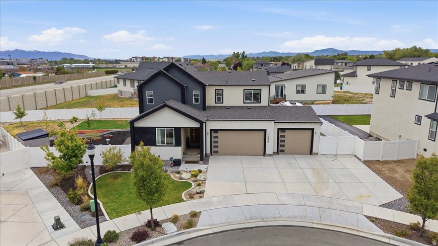 This beautifully upgraded 2021 Garbett home combines thoughtful design and functionality throughout. The customized kitchen showcases premium full length cabinets, large pantry, gas range, wall oven and microwave. The main level offers a versatile bedroom or flex space with a full bath, perfect for guests, office, or multi-generational living. Upstairs you'll find a spacious primary suite with ensuite, two additional bedrooms and a loft area with potential for future bedroom. The finished basement expands your living options with a kitchenette, two bedrooms, a full bathroom, and flex space. A large yard designed for enjoyment, featuring multiple patio areas, an expansive concrete entertaining space, RV parking, and full-perimeter Govee lighting.  Additional conveniences include a man door from the garage for easy backyard access, a garage utility sink, overhead storage racks, and outdoor shed. Custom top-down/bottom-up window coverings throughout provide both privacy and natural light control, completing this truly move-in-ready home. Square footage figures provided as a courtesy, obtained from county records. Buyer is advised to obtain an independent measurement.