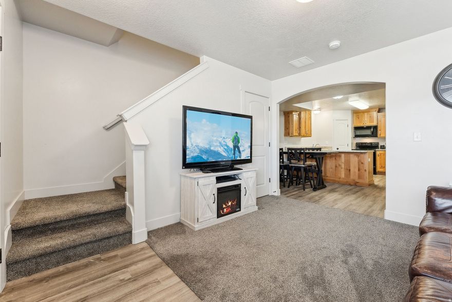 Discover this turn-key townhouse nestled in the River Valley subdivision. A bright open main level featuring granite countertops, knotty alder cabinets, sleek finishes and easy flow.  2 spacious bedrooms upstairs with a full bath; guest half bath and laundry on the main floor.  The building is at the end of the complex and offers ample green space and a front porch with mountain views. The seller has added high-speed internet for fast connectivity.  All appliances are included!!  USDA-eligible financing may make this home accessible with lower down payment.  HOA dues of $99/month have never increased during the sellers ownership.  Whether you're looking for your first home, investment opportunity, or a simplified living option - this property delivers modern comfort, smart value, and a great location. Close to I-15, yet tucked away off a busy road. Come see why this townhouse offers the best value, with more open space.