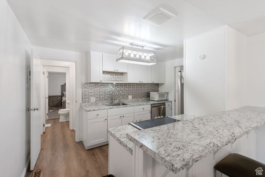 Welcome to this beautifully updated 4-bedroom, 1.5-bath home that blends comfort and flexibility in a private, quiet neighborhood. You will love the updates with new appliances and new carpet. Featuring both a separate side entrance and a basement entrance that could have great potential for separate living space. This property offers excellent potential for multi-generational living. The home boasts modern updates, with plenty of natural light and a functional layout. The large backyard is perfect for entertaining, gardening, or relaxing. The basement is 50% finished, offering extra living space, yet ready for your personal customization to truly make it your own. Don't miss this versatile home with room to grow, inside and out! Short distance to BYU and UVU and only a few blocks from lots of shopping and restaurants.