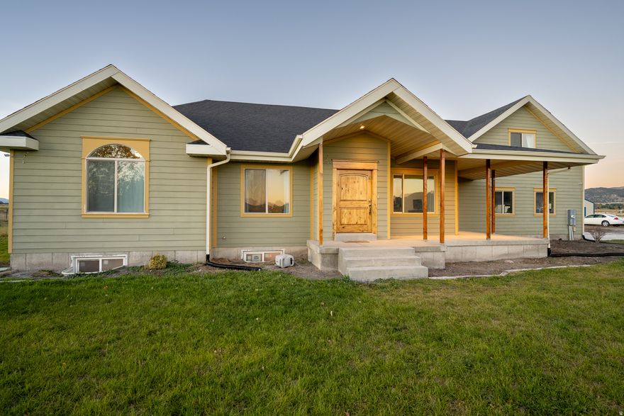 Spacious 3,600 sq ft home on 2.5+ irrigated acres with a large shop in a quiet cul-de-sac just outside Malad City. Located in Elkhorn Peak Ranchettes, the property offers a peaceful country setting with easy access to town and I-15. The home features an open layout, generous living spaces, and room for animals or hobbies. Enjoy views of the surrounding valley and mountains, plus the flexibility of owning acreage with minimal upkeep. Properties like this-offering a well-maintained home, shop, and irrigated ground-don't come up often. Schedule your showing today.