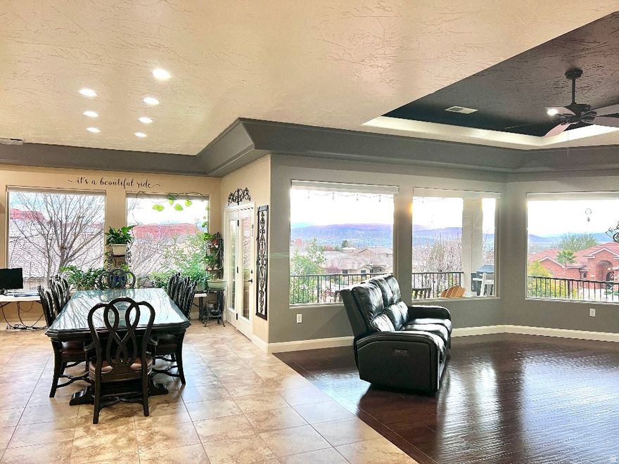 Welcome to your gorgeous retreat in sunny St George! Enjoy cul-de-sac living with large gathering spaces, high-end finishes, fresh paint, an oasis yard and garden, over-sized garage, whole-house water filtration, a security system, 10 foot+ ceilings throughout, movie projector and screen, raised theater seating, large storage spaces, and huge windows for lots of natural light! This beautiful home is next to a natural spring pond and park with amazing wildlife, and it is perfectly located for easy access to everything. Enjoy INCREDIBLE views from the deck, s-mores around the firepit, the added space of a permanent shed/playhouse, solar screens, trampoline, as well as mature trees, pomegranates, blackberries, and grapes! Come see for yourself how immaculate and well-cared for this property truly is!