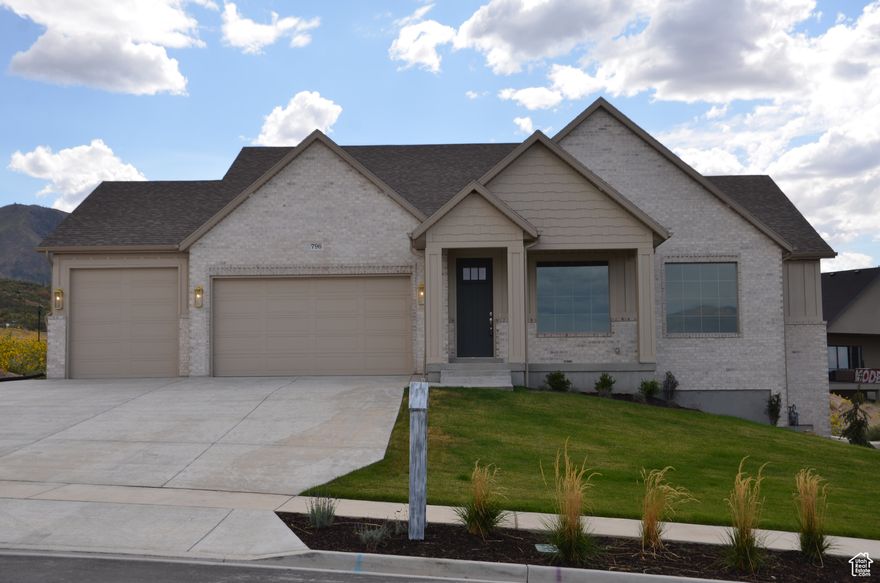 Stunning Brand-New Rambler with Valley-Wide Views in Salem's Hottest Community!  Welcome to 796 Ridge View Dr, Salem, UT  a newly built 2025 luxury rambler by Gordon Milar Construction, the exclusive builder in the renowned Three Bridges development. This home delivers elevated design, quality craftsmanship, and one of the most spectacular view lots in Utah County, with unobstructed vistas stretching north across the valley.  Property Highlights:  Bedrooms/Bathrooms: 5 bedrooms, 3.5 bathrooms  -Garage: Oversized 3-car garage with extra depth for 4-car capacity plus suspended slab for additional storage  -Layout: Open-concept main floor with large family room, gourmet kitchen with island, and spacious dining area  perfect for entertaining  -Main Floor Living: Owner's suite with spa-like bath & walk-in closet, plus additional bedroom and full bath on the main  -Finished Basement: Expansive family room, two additional bedrooms, full bath, dedicated flex/game room (perfect for a gym, pool table, ping pong, or hobby space), and a future theater/golf simulator room ready for your custom finish  -Premium Finishes: Designer cabinetry, quartz countertops, upgraded flooring, energy-efficient windows, and meticulous attention to detail throughout  Location & Lifestyle:  -Located in Ridge View, Salem's premier new subdivision  -Quick access to Spanish Fork, I-15, shopping, and dining  -Quiet, upscale neighborhood with virtually no crime  -Surrounded by trails, outdoor recreation, and unmatched mountain and valley views  Why You'll Love It: Both levels are fully finished (except for the customizable theater/simulator room), giving you move-in-ready comfort and space to grow. Whether you're hosting gatherings, enjoying quiet mornings on the porch, or designing your dream theater or golf simulator, this home adapts to your lifestyle.