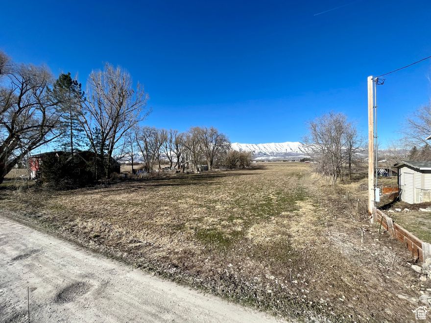 Looking for a country feel with the convenience of city life minutes away? This is the lot for you. Located just south of Logan in College Ward, you get the best of both worlds. This beautiful, flat, 1.07 acre lot is ideal to build your dream home, with land for; animals, a shop, or whatever your heart desires, and is minutes from shopping, dining and easy access to the highway. Come take a look and see if this lot fits all your needs! This lot has a well already drilled and capped. The well right includes enough water for 1 home, 10 livestock and .25 acre irrigation. There is power connected to the lot currently, and natural gas is nearby and available if you'd rather have that over propane. There is no sewer, so a septic system will need to be installed. This lot is currently in Greenbelt status. No HOA, bring your own builder or I can recommend a few really good ones, and build your dream house! Square footage figures are provided as a courtesy estimate only and were obtained from Cache County Records. Buyer is advised to obtain an independent measurement.