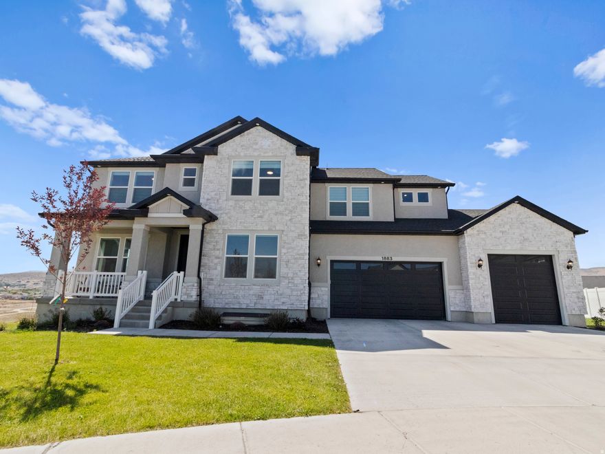 Gorgeous view sitting high above the Ranches golf course and an unobstructed mountain view on this breathtaking new home. This beautifully upgraded Vincent floorplan sits at the top of a cul-de-sac in the most incredible family-friendly neighborhood. Views of mount Timpanogos from the front bedrooms and views of the west mountains from the back of the home. Extra long driveway and extra long garage at 28 ft deep; fits full size SUV's and trucks perfectly. An extended owner's closet from the builder base plan creates an oasis for your excessively large wardrobe needs. Large Primary bedroom with sitting area and vaulted ceiling. 9ft ceiling height in the basement and main floor; 8ft doors on the main floor. Cold storage under the front porch, partial yard finished with grass for pets, and space for your future backyard dreams! Electric, remote controlled blinds throughout the main floor, and in the primary bedroom. The kitchen boasts double-stacked cabinets, gas range and a large walk-in pantry. This is your opportunity for a unique homesite, unique panoramic view and customized floorplan features you won't find in another home like it.