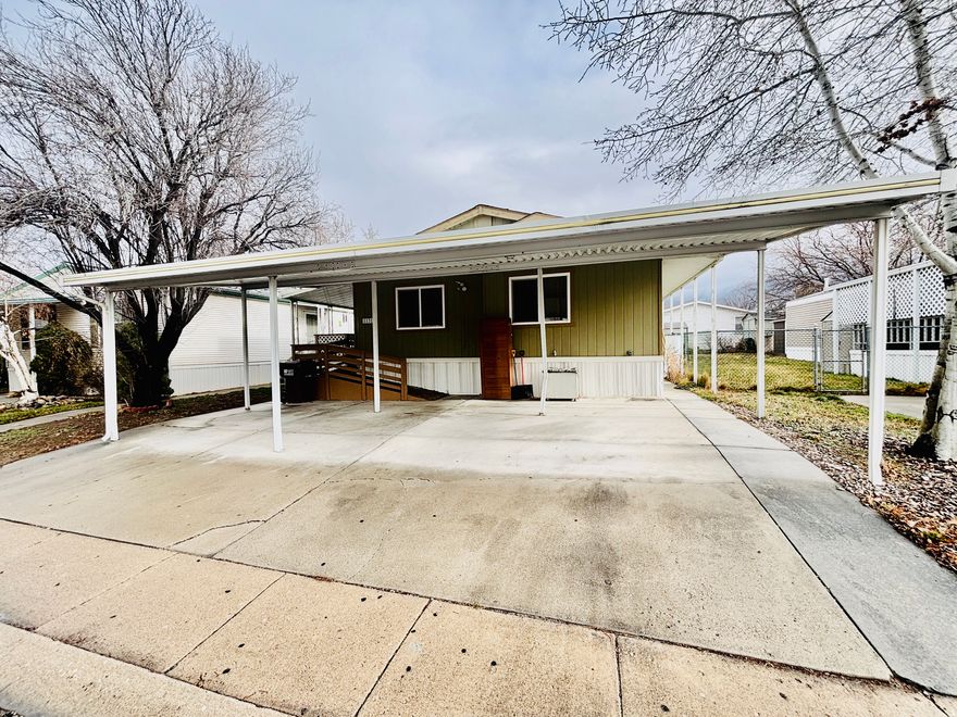 Welcome to this well-maintained double-wide mobile home, ideally located in Crestwood Village close to shopping, dining, and quick interstate access-perfect for easy commuting and everyday convenience. Built in 1994, the home offers 3 bedrooms and 2 full bathrooms, providing a comfortable and functional layout. The large family room is the heart of the home, featuring a cozy fireplace that creates a warm and inviting space for relaxing or entertaining. Outside, enjoy a covered, carpeted patio, ideal for outdoor dining or unwinding year-round. The property also includes parking for up to three vehicles, adding extra convenience for guests or multi-car households.   Whether you're looking for an affordable primary residence this home combines space, comfort, and affordability.
