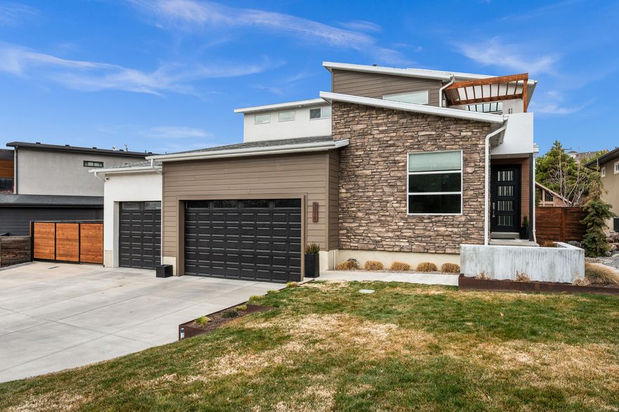 New Price!! Central to everything Utah has to offer, this East Bench home, in Cottonwood Heights, is located at the base of the Wasatch Mountains, home to the best snow on earth, with 20-minute access to Snowbird, Alta, Solitude, and Brighton. Built in 2015, this home boasts a modern design, upgraded appliances, cabinets, and finishes, and a 2019 custom-finished basement with a kitchenette and built-ins. The primary balcony has views of the Wasatch Mountains. Large kitchen with quartz tops and SS appliances, including beverage fridge, deck, patio with/ gas firepit, three-car garage with/ ~ 12' ceilings + built-in storage racks, RV pad, 1st floor office, new primary furnace, Jellyfish permanent lighting, heat-tape to prevent snow and ice build-up on the roof. Original owners. Square footage figures are provided as a courtesy estimate only and were obtained from a previous appraisal. Buyer is advised to obtain an independent measurement.
