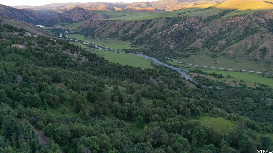 This exclusive gated Bear River Ranch property teeming with mature trees and bird's eye views of the mountains and Bear River is the perfect mountain getaway just minutes from Preston. Two separate secluded build sites with panoramic views and seasonal dirt road access await. The terrain is wooded and mountainous with moderate to steep slopes and draws. Towering evergreens and plentiful deciduous trees blanket much of the surrounding Bear River Ranch area. An active HOA maintains the combination gate and network of seasonal dirt roads that provide access to the properties. Outdoor enthusiasts will appreciate the proximity to the Oneida Canyon Recreation Area which is located on Oneida Narrows Road. Swimming, boating at the reservoir, floating the river, camping, hiking, river and reservoir fishing, bird watching, wildlife viewing, and hunting are available to the public as part of the Wildlife Habitat Management Area provided by PacifiCorp who owns and manages the adjacent property along the Bear River and, also by the U.S. Department of the Interior Bureau of Land Management. During the winter months, a snow machine is required to access the property and opens the door to a magical winter wonderland to enjoy snowshoeing, cross country skiing or snowmobiling. Power is not available so solar power or a portable generator is recommended. Contact the listing agents to schedule a tour.  Wooded mountain property with moderate to steep slopes and draws  2 separate cleared build sites with seasonal dirt road access and panoramic views of mountains and Bear River  Locked combination gate access to network of seasonal dirt access roads  Property is adjacent to PacifiCorp property  Seasonal access 3.2 miles off Oneida Narrows Road  Oneida Narrows Road is a county-maintained gravel road providing public access to Oneida Canyon Recreation Area, Oneida Narrows Reservoir and Campground  Active Bear River Ranch HOA  2 older trailers are included or could be removed  Power not available  Hunting Unit 77  Area fishing for small mouth bass, walleye and yellow perch